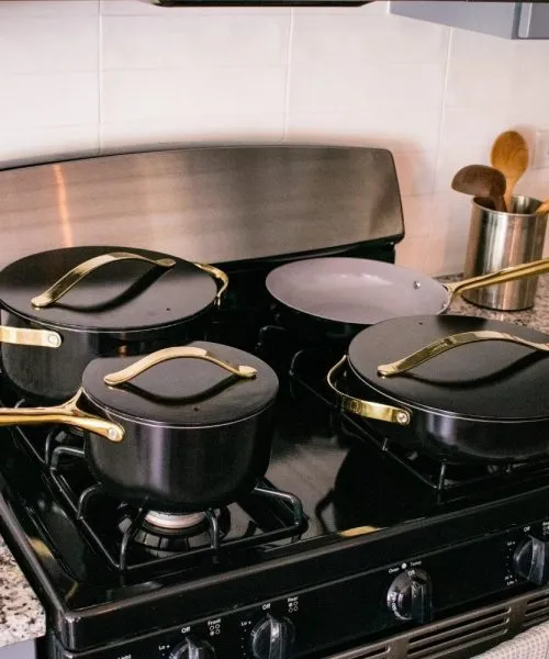 Caraway nontoxic cookware set in black and gold