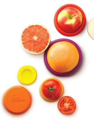 silicone food huggers in yellow, red, orange, and purple