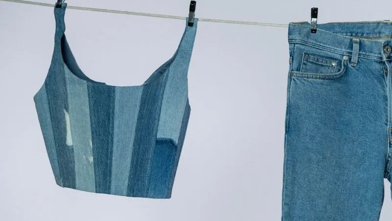 close-up of denim top and denim jeans on clothes line