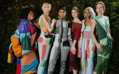 Mahdiyyah Muhammad stands with a group of models wearing her upcycled designs