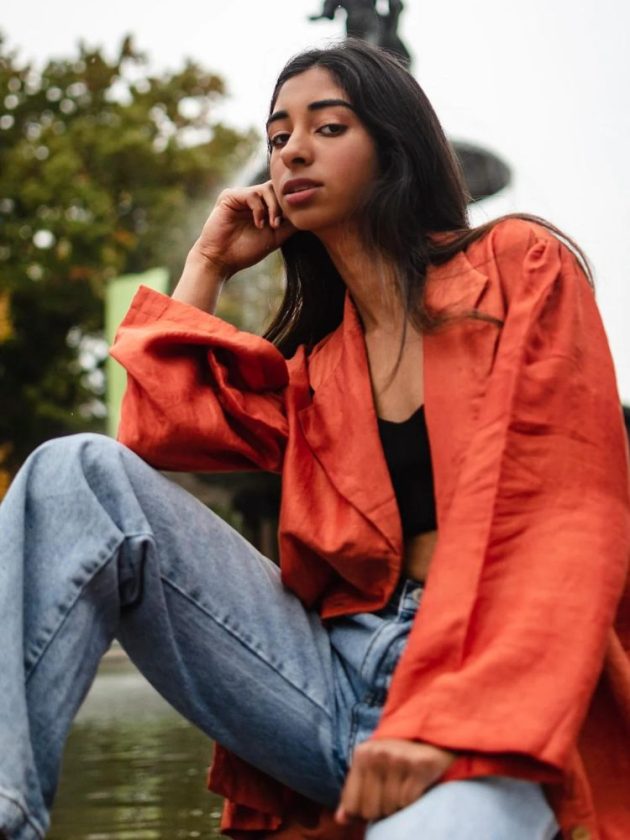 model wearing orange jacket from slow fashion label Banai