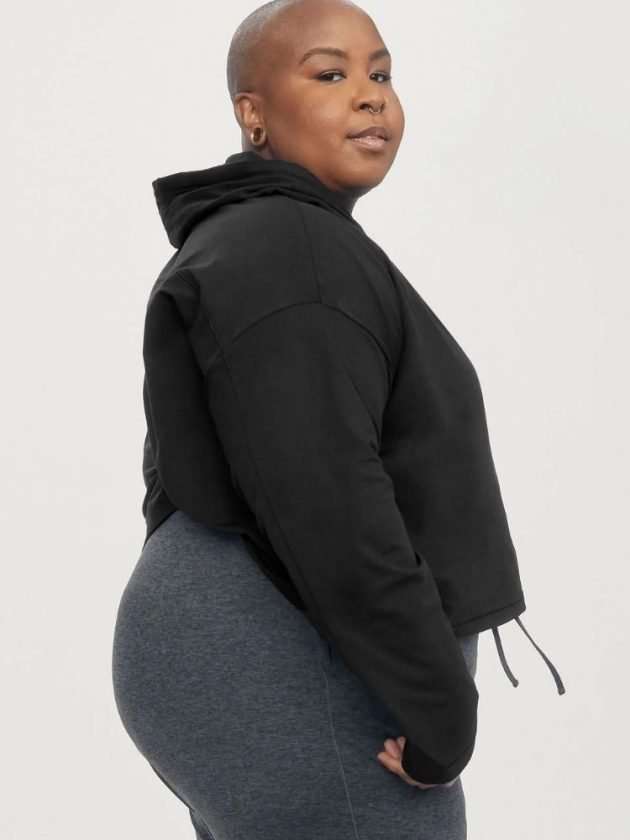 model wearing black hoodie and gray leggings - sustainable loungewear from Girlfriend