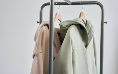 sustainable clothing hanging on silver rack